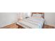 Bedroom featuring light hardwood floors, and a patterned bedspread with tassel details at 111 Dunstan Ave, Durham, NC 27707