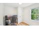 Bedroom with hardwood floors, white walls, a small desk, and a natural light from a window at 111 Dunstan Ave, Durham, NC 27707