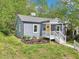 A quaint single-story home with a gray exterior, white trim, and a welcoming front porch at 111 Dunstan Ave, Durham, NC 27707