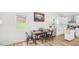 Bright kitchen and dining area with modern appliances, white cabinets, and stylish decor at 111 Dunstan Ave, Durham, NC 27707