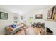 Open-concept living room with hardwood floors, natural light, and a dining area at 111 Dunstan Ave, Durham, NC 27707