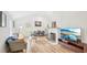Inviting living room with hardwood floors, a cozy fireplace, and open flow to the kitchen at 111 Dunstan Ave, Durham, NC 27707