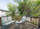 Relaxing back deck featuring chairs and a small table, perfect for enjoying the outdoors and entertaining guests at 1116 Holburn Pl, Raleigh, NC 27610
