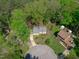An aerial view of a home on a cul-de-sac featuring a sprawling backyard and mature trees at 1120 Shetland Ct, Raleigh, NC 27609