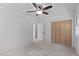 Bedroom with neutral walls, carpet, closet, ceiling fan, and updated lighting at 1120 Shetland Ct, Raleigh, NC 27609