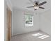 Bedroom with neutral walls, carpet, ceiling fan, and closet at 1120 Shetland Ct, Raleigh, NC 27609
