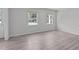 Bright bedroom featuring neutral walls and hard surface flooring at 1120 Shetland Ct, Raleigh, NC 27609
