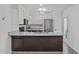Modern kitchen with stainless steel appliances, white cabinets, and a central island at 1120 Shetland Ct, Raleigh, NC 27609
