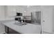 Well-equipped kitchen featuring modern stainless steel appliances and white cabinets at 1120 Shetland Ct, Raleigh, NC 27609