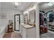 Bathroom with a double vanity, walk in closet, and a full glass shower at 119 Wolf Creek Dr, Wendell, NC 27591