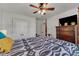Bedroom featuring a ceiling fan, closet, and a dresser for storage at 119 Wolf Creek Dr, Wendell, NC 27591