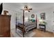 Charming bedroom with a ceiling fan, natural light, and patterned area rug at 119 Wolf Creek Dr, Wendell, NC 27591