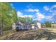 Side view of a well maintained home, set within a green yard at 119 Wolf Creek Dr, Wendell, NC 27591