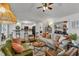 Open-concept living room with hardwood floors, neutral colors, and stylish furniture at 119 Wolf Creek Dr, Wendell, NC 27591