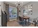 Well-lit office space with a modern light fixture and geometric patterned rug at 119 Wolf Creek Dr, Wendell, NC 27591