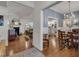 Open-concept floorplan with living and dining areas, featuring hardwood floors and neutral decor at 119 Wolf Creek Dr, Wendell, NC 27591