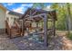 Inviting backyard patio with comfortable seating and a pergola, perfect for outdoor entertaining at 119 Wolf Creek Dr, Wendell, NC 27591
