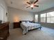 Spacious bedroom features a ceiling fan and lots of natural light at 120 Putters Ct, Durham, NC 27703