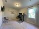 Well-lit bedroom with a functional desk, comfortable chair, and ample workspace at 120 Putters Ct, Durham, NC 27703