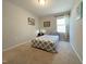 Comfortable bedroom with a cozy bed, natural light, and tasteful decor at 120 Putters Ct, Durham, NC 27703