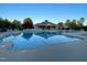 A pristine community pool awaits, surrounded by lounge chairs and a shaded pavilion at 120 Putters Ct, Durham, NC 27703