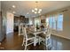 Charming dining room featuring hardwood floors, decorative chandelier, and a bright window at 120 Putters Ct, Durham, NC 27703