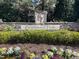 Beautiful community entrance sign, 'Brightwood Trails', adorned with flowers and greenery at 120 Putters Ct, Durham, NC 27703