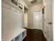 Inviting entryway with a built-in bench, storage, and modern finishes at 120 Putters Ct, Durham, NC 27703
