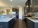 The kitchen features stainless steel appliances, granite countertops, and dark wood cabinetry at 120 Putters Ct, Durham, NC 27703
