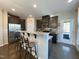 Kitchen with stainless steel appliances, granite countertops, and bar seating at 120 Putters Ct, Durham, NC 27703