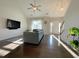 Spacious living room with high ceilings, hardwood floors, and a view of the front entrance and staircase at 120 Putters Ct, Durham, NC 27703