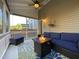 Inviting screened porch with a fire pit and comfortable seating for outdoor enjoyment at 120 Putters Ct, Durham, NC 27703