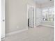 Neutral bedroom with plush carpet, and closet at 1203 Great Egret Way, Durham, NC 27713