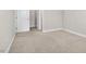 Neutral bedroom with plush carpet, fresh paint, and walk-in closet at 1203 Great Egret Way, Durham, NC 27713