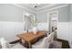 Dining area showcases stylish decor, including elegant white chairs, hardwood floors, and a modern chandelier at 1203 Great Egret Way, Durham, NC 27713