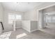 Bright hallway with neutral carpet and fresh paint leads to additional rooms in the home at 1203 Great Egret Way, Durham, NC 27713