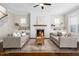 Inviting living room features a cozy fireplace, built-in shelves, and comfortable seating for relaxing and entertaining at 1203 Great Egret Way, Durham, NC 27713