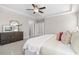 Cozy main bedroom showing the plush bed, ceiling fan, and bright, neutral colors at 1203 Great Egret Way, Durham, NC 27713