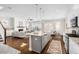 Bright open-concept space combines the kitchen, living room, and dining area for modern, connected living at 1203 Great Egret Way, Durham, NC 27713