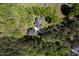 Aerial view of a charming home with a dark roof surrounded by lush, mature trees at 1208 Goodwin Rd, Apex, NC 27523