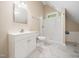 Bright bathroom featuring white vanity, modern fixtures, and sleek marble flooring at 1208 Goodwin Rd, Apex, NC 27523