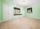 Bedroom with large windows, window seats, and large double door closets at 1208 Goodwin Rd, Apex, NC 27523