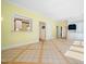 Spacious bonus room with tiled floors, a pass through to the kitchen, and natural light at 1208 Goodwin Rd, Apex, NC 27523