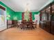 Dining room featuring hardwood floors, a chandelier, and a decorative cabinet at 1208 Goodwin Rd, Apex, NC 27523