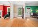 Bright foyer with hardwood floors, colorful walls, and a view of the outdoors at 1208 Goodwin Rd, Apex, NC 27523