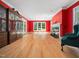 Spacious living room featuring hardwood floors, a fireplace, and plenty of natural light at 1208 Goodwin Rd, Apex, NC 27523