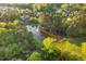 Aerial shot showcasing the community pond surrounded by trees and residential homes at 1216 Caribou Xing, Durham, NC 27713