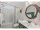 Charming bathroom with green vanity, a shower-tub, and decorative accents for a cozy feel at 1216 Caribou Xing, Durham, NC 27713