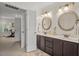 Bathroom with double sinks and views into an adjacent flex space at 1216 Caribou Xing, Durham, NC 27713