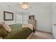 Bright bedroom featuring ample natural light, ceiling fan, and a comfortable bed with plush pillows at 1216 Caribou Xing, Durham, NC 27713